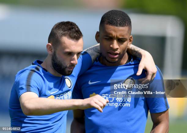 Marcelo Brozovic 9L) and Dalbert Henrique Chagas Estevão of FC Internazionale chat during the FC Internazionale training session at the club's...