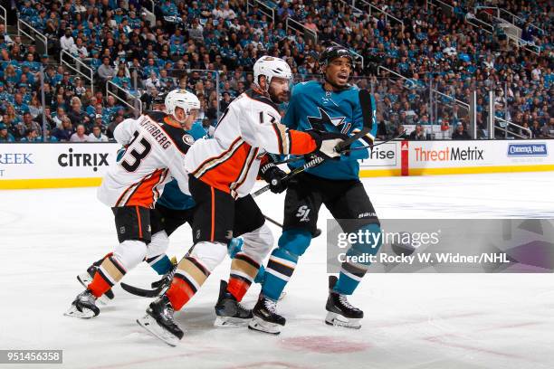 Evander Kane of the San Jose Sharks skates against Jakob Silfverberg and Ryan Kesler of the Anaheim Ducks in Game Four of the Western Conference...