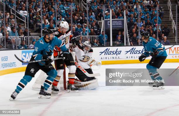 John Gibson and Andy Welinski of the Anaheim Ducks defend the net against Eric Fehr and Marcus Sorensen of the San Jose Sharks in Game Four of the...