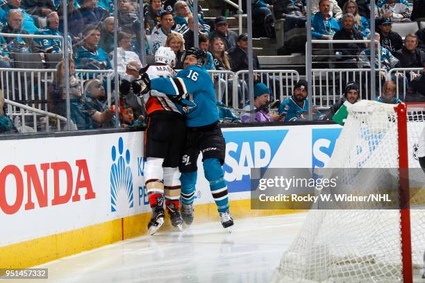 Eric Fehr of the San Jose Sharks collides into Josh Manson of the Anaheim Ducks in Game Four of the Western Conference First Round during the 2018...