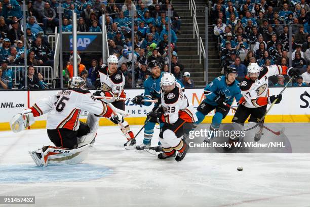 John Gibson, Francois Beauchemin and Ryan Kesler of the Anaheim Ducks defend against Joe Pavelski and Tomas Hertl the San Jose Sharks in Game Four of...