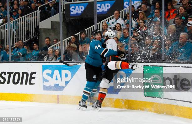 Marc-Edouard Vlasic of the San Jose Sharks collides into Rickard Rakell of the Anaheim Ducks in Game Four of the Western Conference First Round...