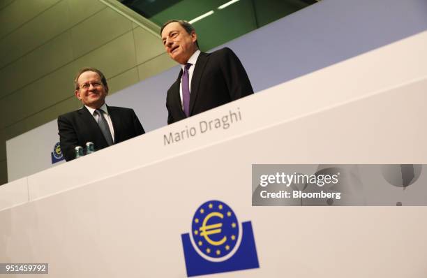 Vitor Constancio, vice president of the European Central Bank , left, and Mario Draghi, president of the European Central Bank , arrive for a news...