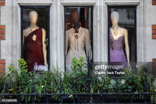 Dresses on display in the window of the Roland Mouret store in Mayfair on April 26, 2018 in London, England. The designer for Meghan Markle's wedding...