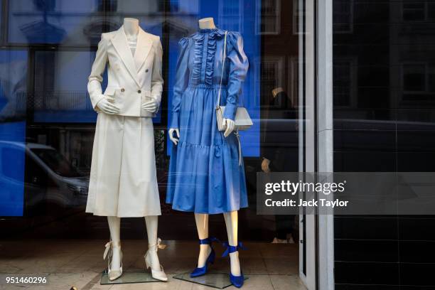 Dresses on display in the window of the Stella McCartney store in Mayfair on April 26, 2018 in London, England. The designer for Meghan Markle's...