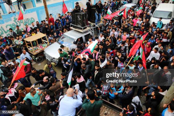 Palestinian mourners carry the body of Palestinian journalist Ahmed Abu Hussein, while who was shot two weeks before by Israeli forces while covering...