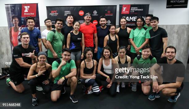 Donald Cerrone poses for photos with participants of an MMA seminar on April 26, 2018 in Singapore.