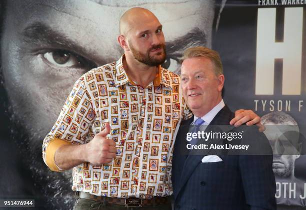 Tyson Fury and promoter Frank Warren pose during a press conference on April 26, 2018 at the Lowry Hotel in Manchester, England. Fury is due to make...