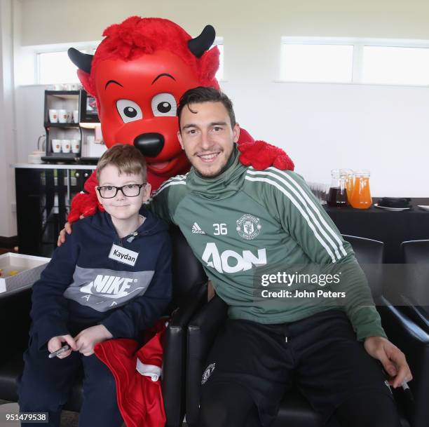 Matteo Darmian of Manchester United poses with Kayden during the MU Foundation Dream Day at Aon Training Complex on April 26, 2018 in Manchester,...