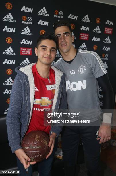 Joel Pereira of Manchester United poses with Arron during the MU Foundation Dream Day at Aon Training Complex on April 26, 2018 in Manchester,...