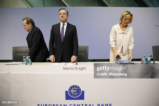 Mario Draghi, president of the European Central Bank , center, arrives with Vitor Constancio, vice president of the European Central Bank, left, and...