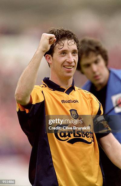 Robbie Fowler of Liverpool salutes the fans after the FA Carling Premiership match against Charlton Athletic played at The Valley, in London....