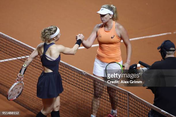 CoCo Vandeweghe of the United States and Laura Siegemund of Germany shake hands after their match during day 4 of the Porsche Tennis Grand Prix at...
