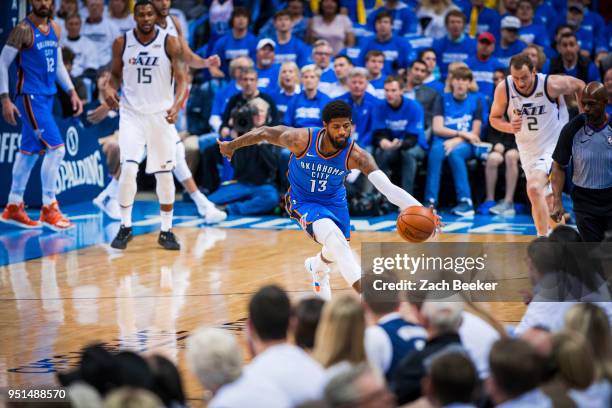 Paul George of the Oklahoma City Thunder saves the ball from going out of bounds in Game Five against the Utah Jazz during Round One of the 2018 NBA...