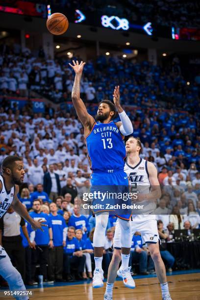 Paul George of the Oklahoma City Thunder drives to the basket and shoots the ball in Game Five against the Utah Jazz during Round One of the 2018 NBA...