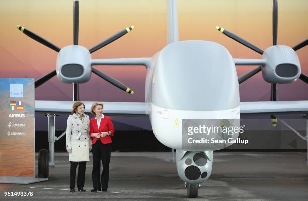 German Defense Minister Ursula von der Leyen and French Defense Minister Florence Parly stand next to the European MALE UAV drone at the Airbus stand...