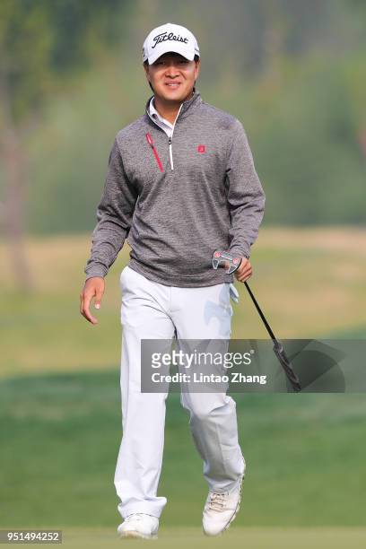 Jin Daxing reacts after the plays a shot during the first round of the 2018 Volvo China Open at Topwin Golf and Country Club on April 26, 2018 in...