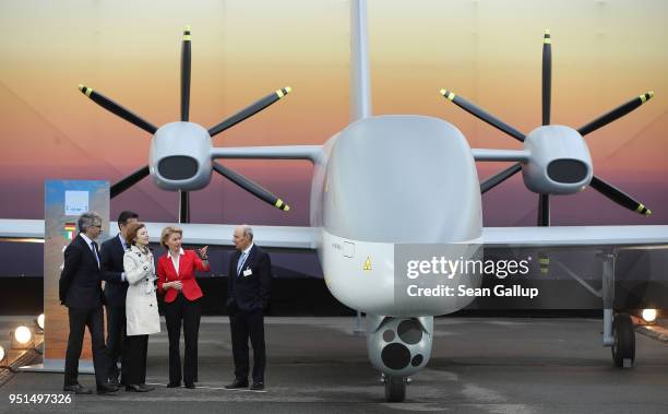 German Defense Minister Ursula von der Leyen , French Defense Minister Florence Parly and Dassault Aviation CEO Eric Trappier stand next to the...