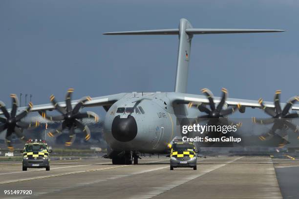 An Airbus A400M military transport plane of the Bundeswehr, the German armed forces, arrives at the ILA Berlin Air Show on April 26, 2018 in...