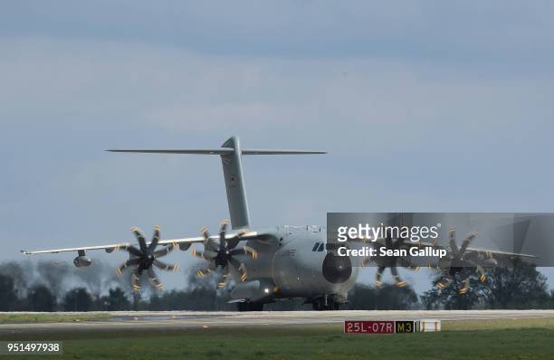 An Airbus A400M military transport plane of the Bundeswehr, the German armed forces, arrives at the ILA Berlin Air Show on April 26, 2018 in...