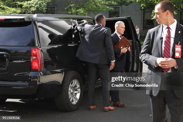 Surrounded by security agents, Environmental Protection Agency Administrator Scott Pruitt steps out of his armored SUV as he arrives to testify...