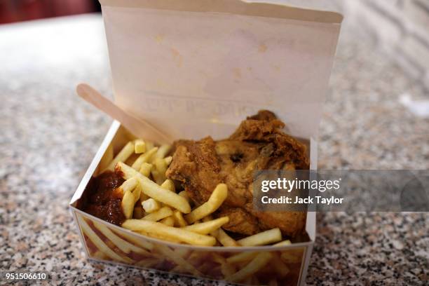 Box of chicken and chips sits on a counter in a chicken shop in Camberwell on April 26, 2018 in London, England. Party leaders have called on the...