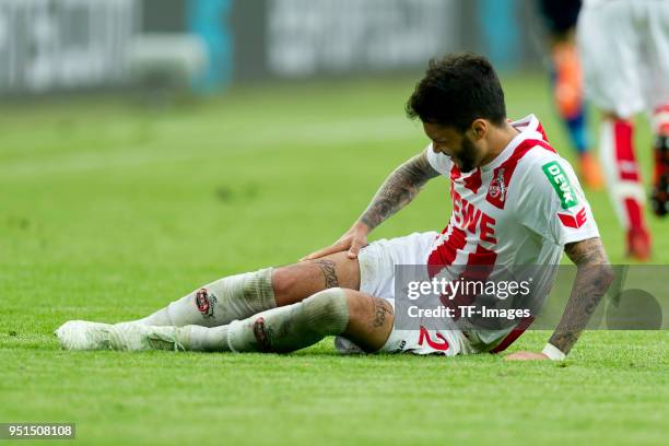 Leonardo Bittencourt of Koeln lays injured on the ground during the Bundesliga match between 1. FC Koeln and FC Schalke 04 at RheinEnergieStadion on...