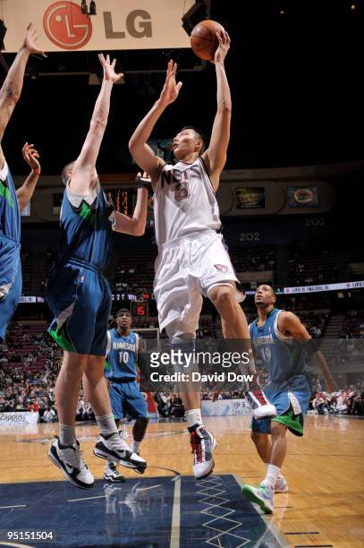 Yi Jianlian of the New Jersey Nets shoots against the Minnesota Timberwolves during the game on December 23, 2009 at the Izod Center in East...