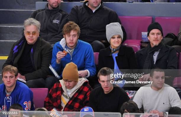 Tim Robbins, his son, Cari Modine and Matthew Modine attend the Florida Panthers vs New York Rangers game at Madison Square Garden on December 23,...