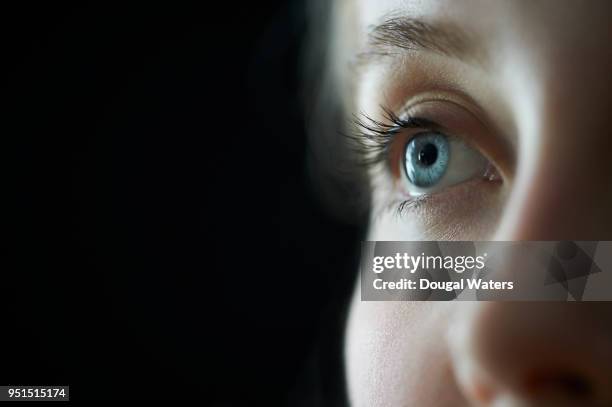 female blue eye close up. - iris stock pictures, royalty-free photos & images