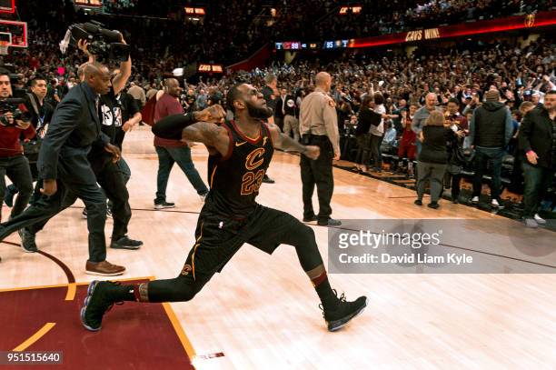 LeBron James of the Cleveland Cavaliers celebrates after hitting the game winner against the Indiana Pacers in Game Five of Round One of the 2018 NBA...