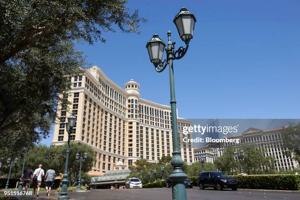 Pedestrians walk towards the MGM Resorts International Bellagio Resort & Casino in Las Vegas, Nevada, U.S., on Wednesday, April 25, 2018. MGM Resorts...