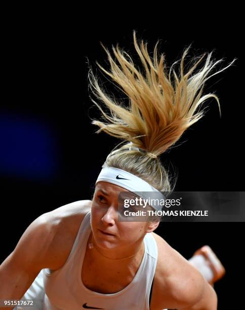 Ukraine's Marta Kostyuk serves the ball to France's Caroline Garcia during the WTA Porsche Tennis Grand Prix in Stuttgart, southwestern Germany, on...