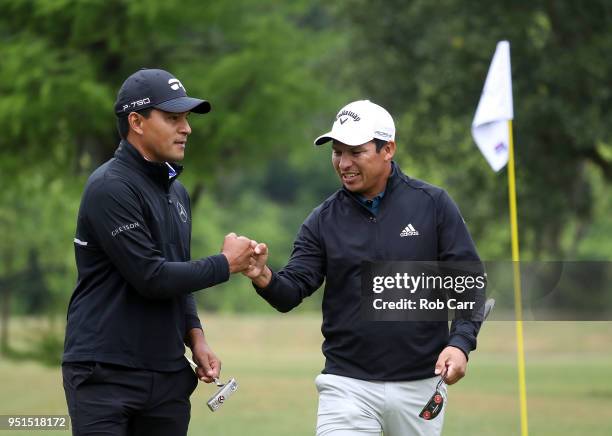 Andres Romero of Argentina and Fabian Gomez of Argentina celebrate a putt on the 15th hole during the first round of the Zurich Classic at TPC...