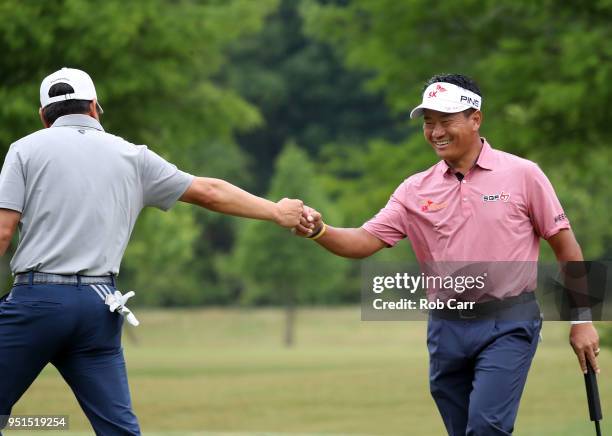 Choi and Charlie Wi react to their putt on the 15th hole during the first round of the Zurich Classic at TPC Louisiana on April 26, 2018 in Avondale,...