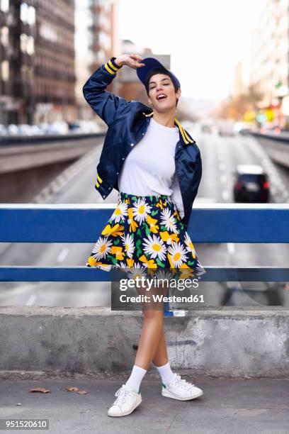 portrait of fashionable young woman wearing skirt with floral design - floral pattern skirt stock pictures, royalty-free photos & images