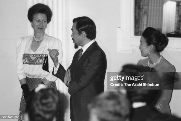 Princess Anne talks with Prince Tomohito and Princess Nobuko of Mikasa during the reception at the British Embassy on September 20, 1990 in Tokyo,...