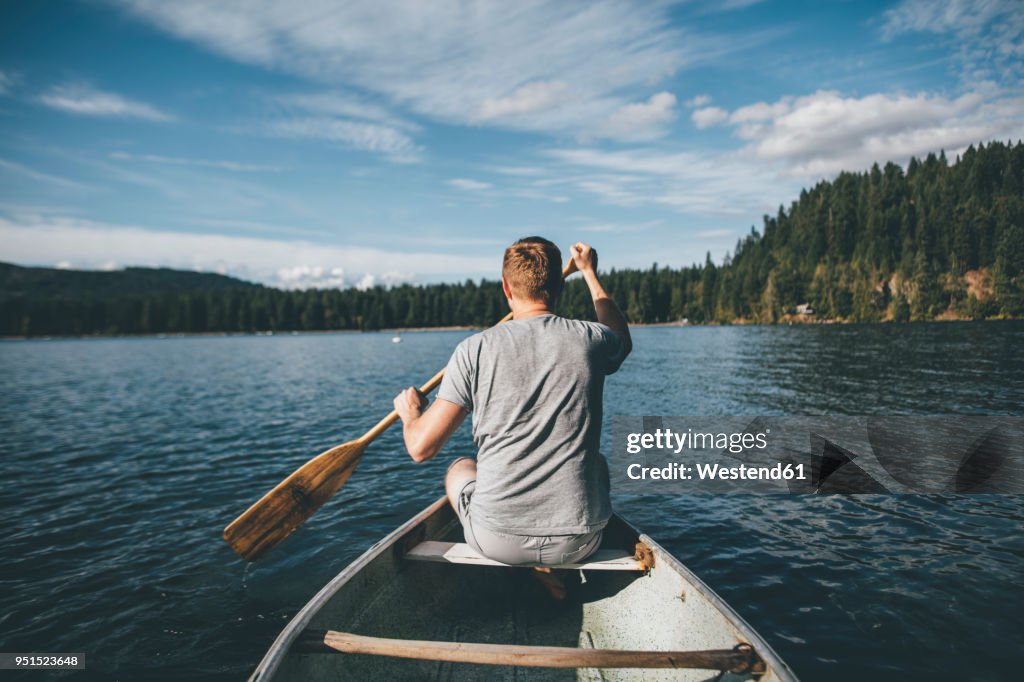 Canada, British Columbia, man in canoe on Cultus Lake