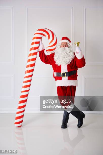 santa claus with handbell and candy cane - big beard stock pictures, royalty-free photos & images