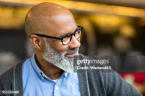 Portrait Of Bald Man With Grey Beard Wearing Glasses High-Res
