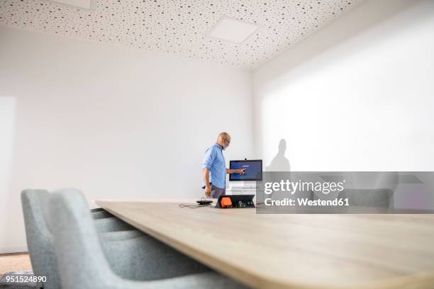 businessman in conference room preparing a presentation - lead off stock pictures, royalty-free photos & images