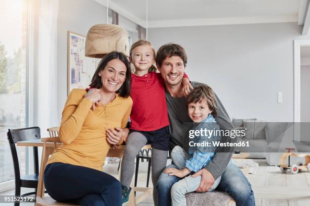 portrait of happy family with two kids at home - family portrait imagens e fotografias de stock