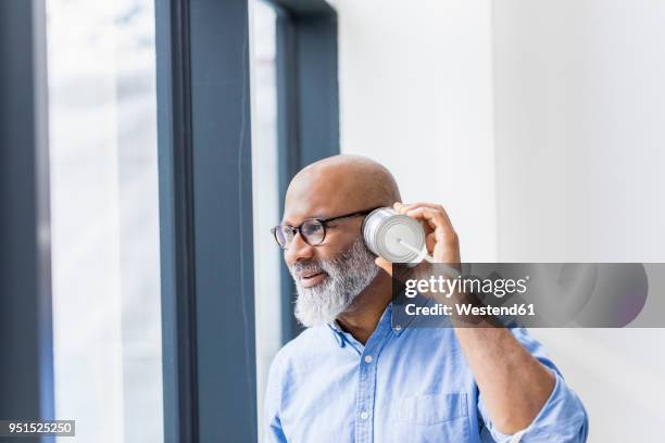 businessman using tin can phone - tin can phone stock pictures, royalty-free photos & images