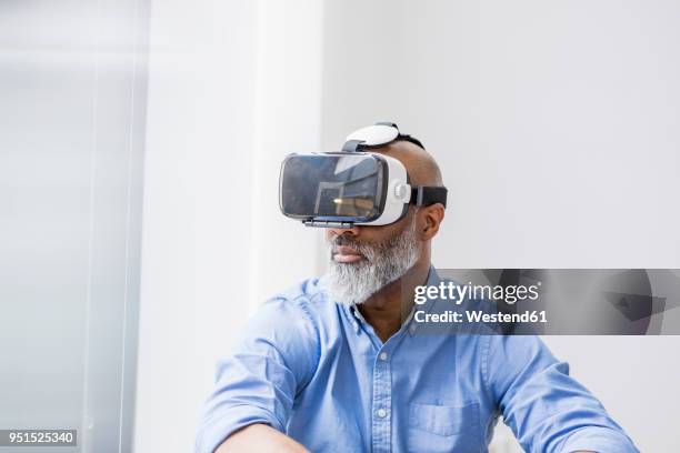 businessman using virtual reality glasses - look stock-fotos und bilder