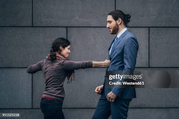 businessman and woman fighting - small man and tall woman stock pictures, royalty-free photos & images