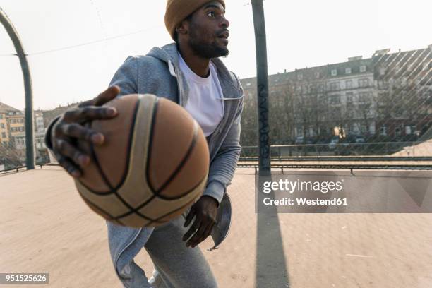 basketball player in action on court - streetball stock-fotos und bilder