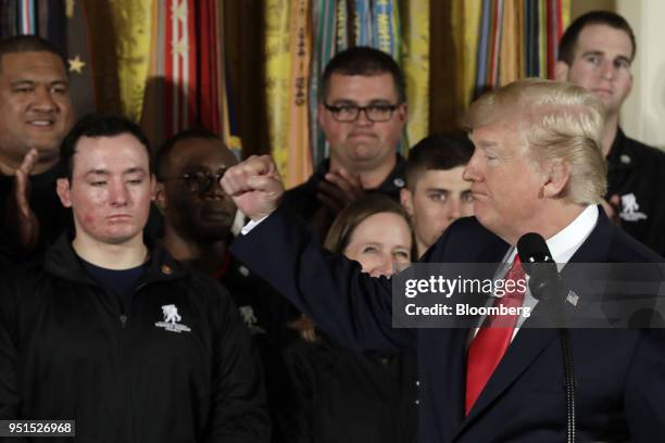 President Donald Trump gestures during an event with the Wounded Warrior Project veterans to kick off the annual Soldier Ride in the East Room of the...