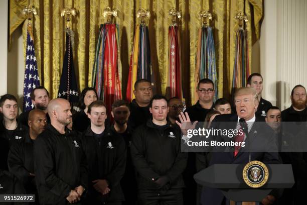 President Donald Trump, right, speaks during an event with the Wounded Warrior Project veterans to kick off the annual Soldier Ride in the East Room...