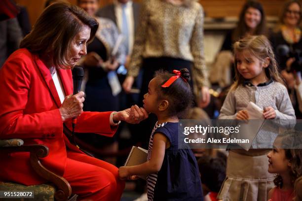 House Minority Leader Nancy Pelosi speaks with journalists' kids during her weekly press conference on 'Take our Daughters and Sons to Work Day' at...