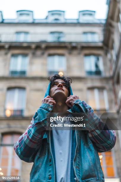 young man looking up - sassy paris stock pictures, royalty-free photos & images